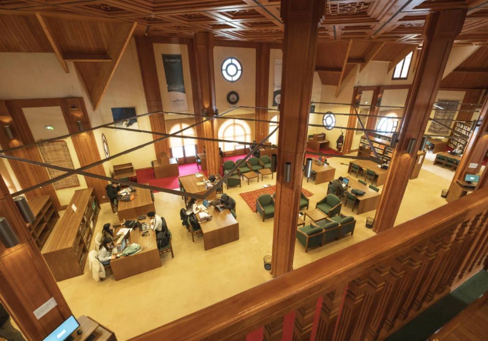 Students reading books inside the library.